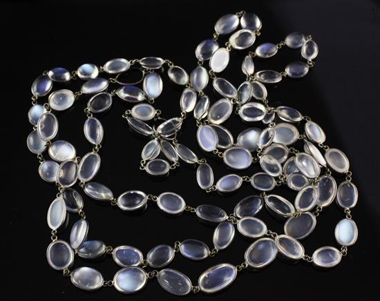 An early 20th century silver and moonstone spectacle necklace, 51in.